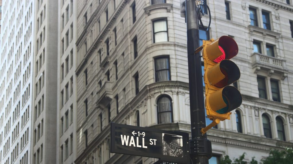 Wall Street and Broadway signs in New York City.